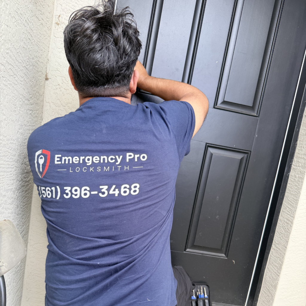 Emergency Pro Locksmith technician working on a black residential front door lock in Port St. Lucie