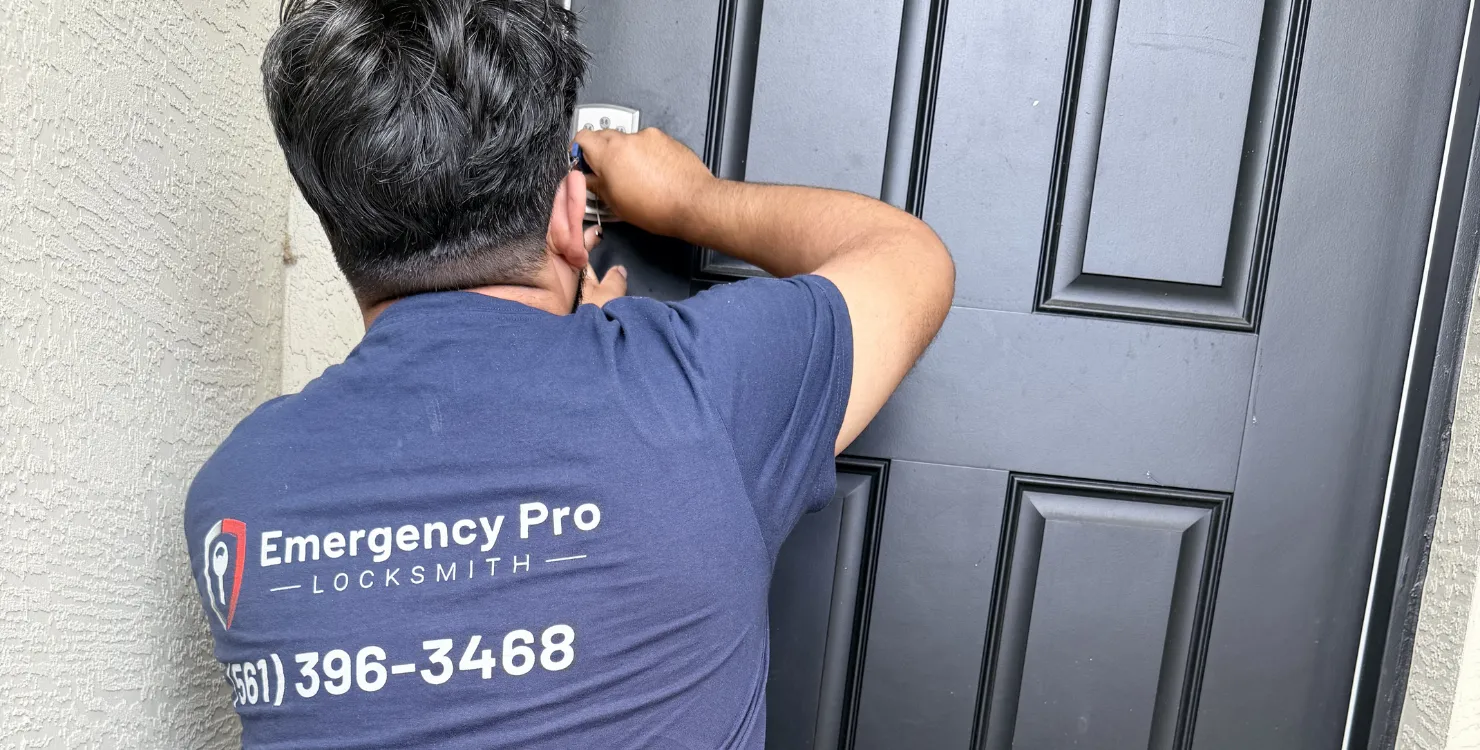 Emergency Pro Locksmith technician in branded uniform standing beside a customer's car after service in Port St. Lucie, Florida