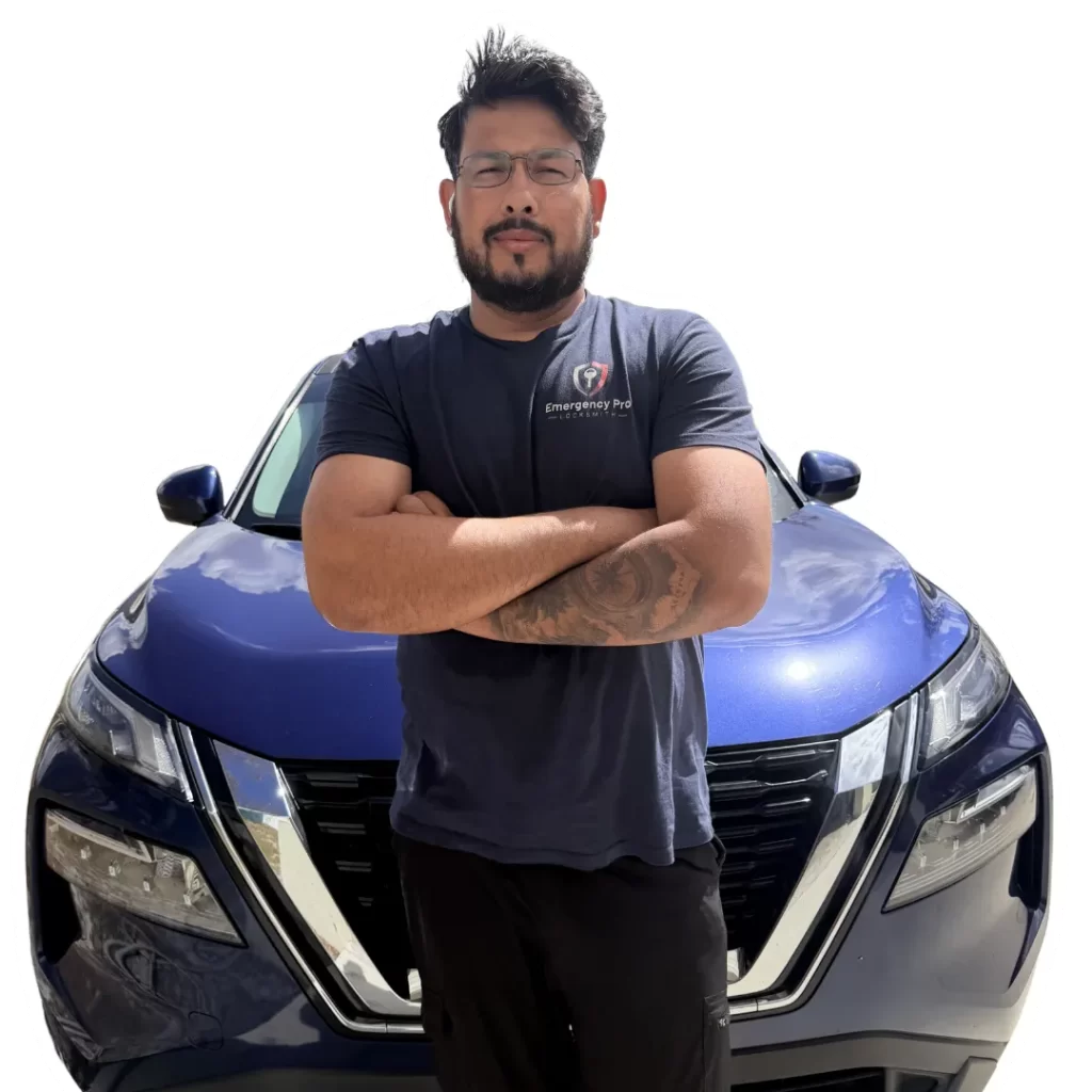 Moab, owner of Emergency Pro Locksmith, photographed in front of a customer's blue SUV — automotive locksmith services in Port St. Lucie & Fort Pierce