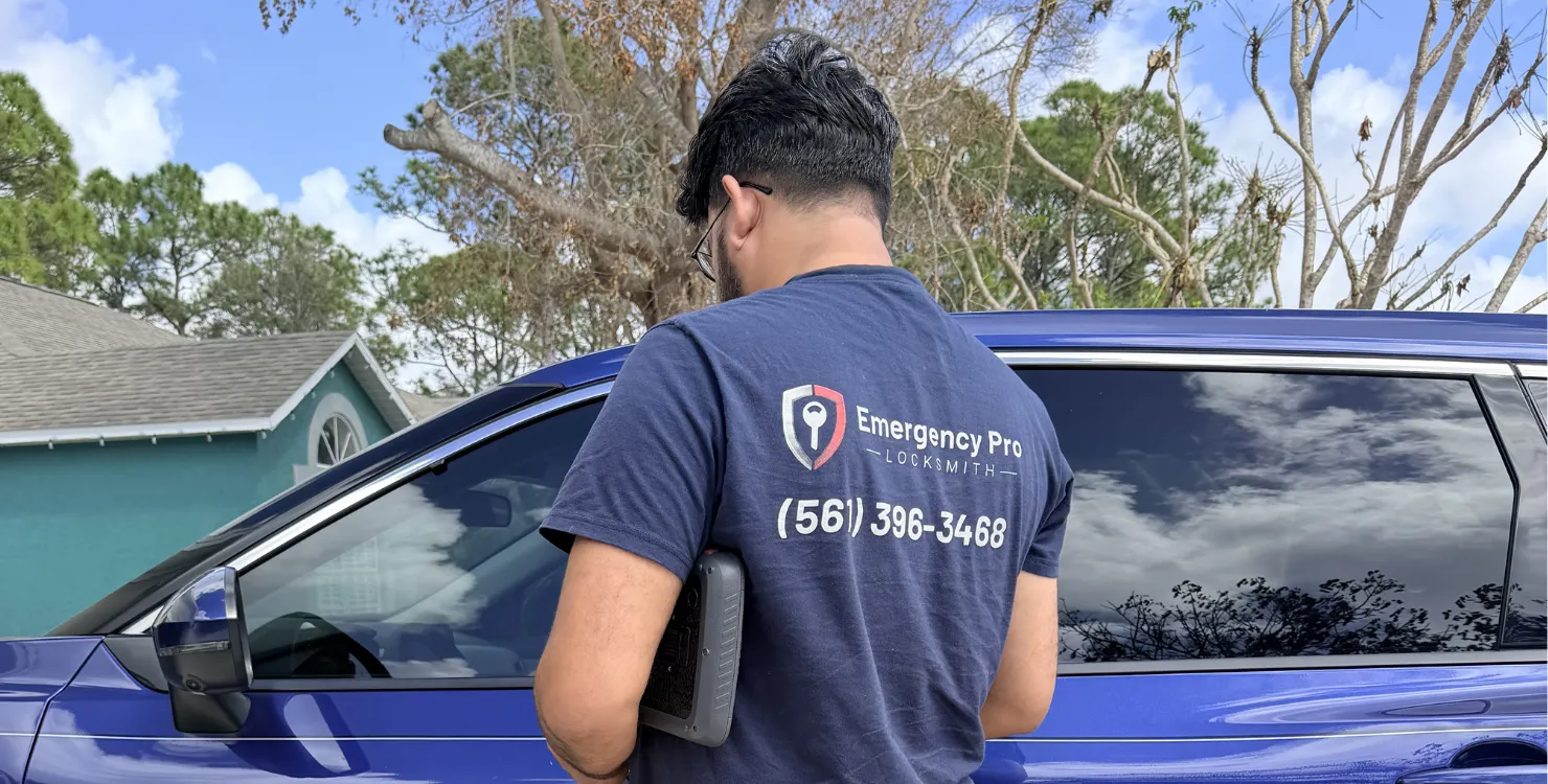 Locksmith working on a residential front door in Port Saint Lucie, FL