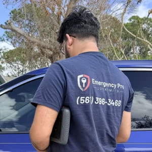Emergency Pro Locksmith technician unlocking a residential front door during a house lockout call in Port St. Lucie, Florida